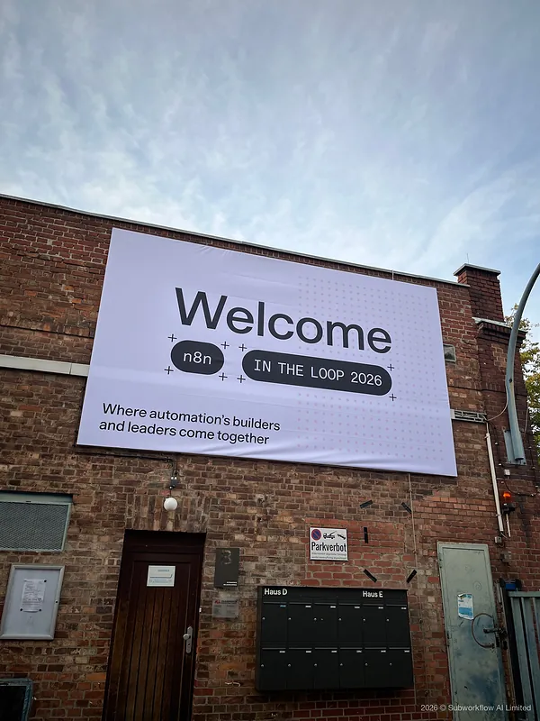 The In The Loop 2026 welcome banner on the brick front of the venue: “Where automation’s builders and leaders come together”