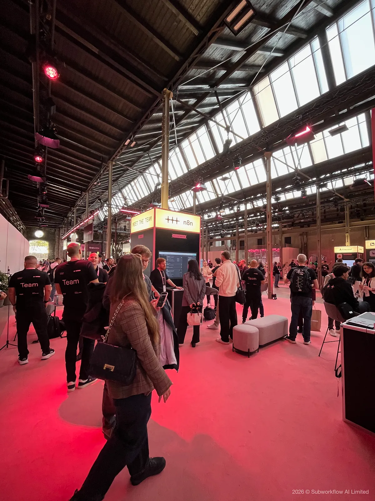 The n8n Meet the Team stand, with staff in Team shirts